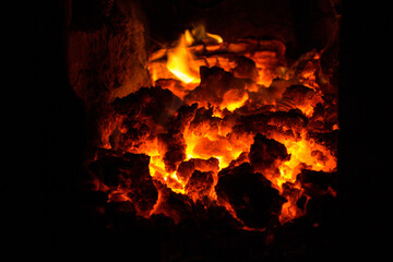 Hot coals in the oven close-up, fire, flame, ash, black, red, for installation, hot, atmosphere,...