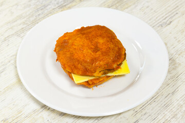 Big tasty burger with beef cutlet on a plate. Hamburger, cheeseburger with mushroom. Crispy chicken burger.
