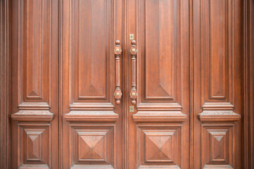 Old wooden brown door , front view