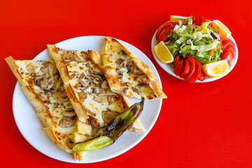 Kiymali pide. Turkish pide with minced meat. Turkish pizza mince pita Pide on white background. Etli ekmek. Kusbasi kasarli, kiymali kasarli, kiymali yumurtali, Bafra, Trabzon, Kusbasili pide.