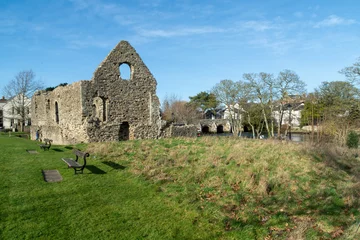 Foto op Canvas Christchurch, UK - February 19th 2023: Alongside the River Avon is the remains of the Norman House, it is a Grade I Listed Building known as the Constable's House and built in 1160AD.  © Pablo L Mendoza