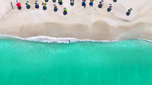 Aerial top down view of the beautiful Darkwood Beach at Antigua island, Caribbean Sea, with fine sand and turquoise, shining sea