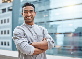 Portrait, smile and businessman in city with arms crossed for confidence, entrepreneurship or start up. Male person, happy and proud with company progress for career, job or corporate employment
