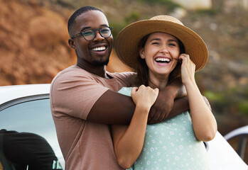 Interracial couple, portrait and road trip for hug by nature, environment and countryside for vacation. Adventure, people and smile or funny outdoor for holiday, journey or relax by car together