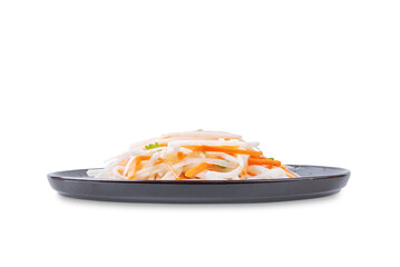 Daikon radish carrot noodles salad on a white isolated background