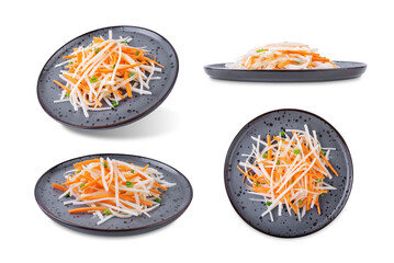 Daikon radish carrot noodles salad on a white isolated background