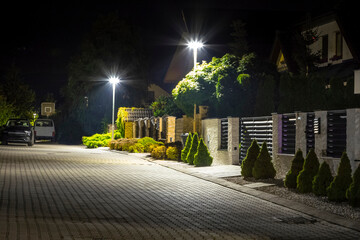 safety night street in residential area, modern street lights - 790111176