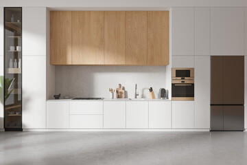 Stylish home kitchen interior with cooking cabinet and kitchenware, fridge