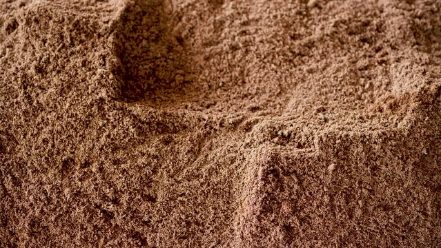 Mixing soil for growing mushrooms.