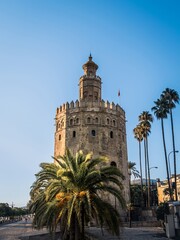 Fototapeta na wymiar The Torre del Oro tower bastion in Seville, Andalusia, Spain, next to the Guadalquivir river