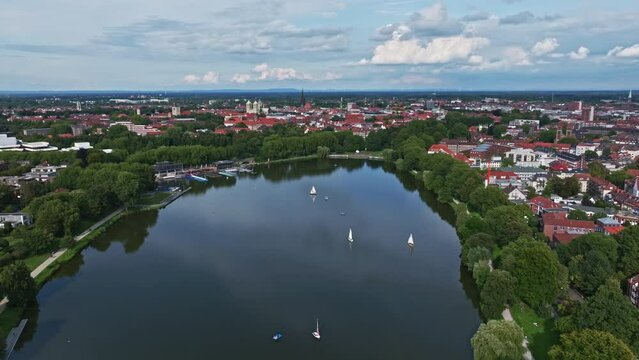 An aerial drone view of Aasee Lake in M&uuml;nster . Lake Aasee is an artificial lake located in M&uuml;nster , Germany .