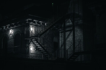 Metal fire exit stairs in a back of old brick building. Brighton, East Sussex, UK