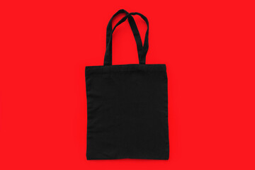 Black cotton, canvas, tote, mesh bag on red background. Zero waste, no plastic, eco friendly...