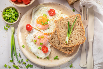 British breakfast with fried eggs and bread.
