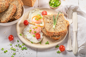 Delicious and crisp breakfast with egg, tomato and bread.