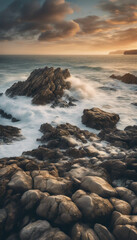 Obraz premium beautiful coastal landscape with rocky shores, the ocean, sunrise and a sky