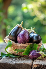 eggplants in burlap on a wooden table
