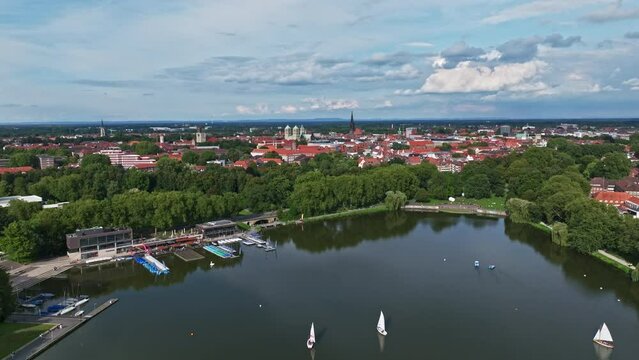 An aerial drone view of Aasee Lake in M&uuml;nster . Lake Aasee is an artificial lake located in M&uuml;nster , Germany .