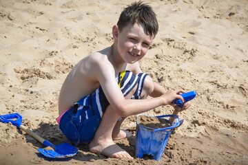 Young boy playing on beach