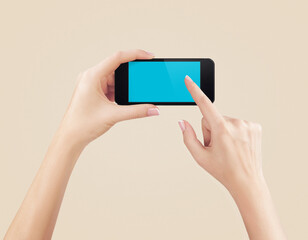 Female hands holding mobile phone with blank screen isolated
