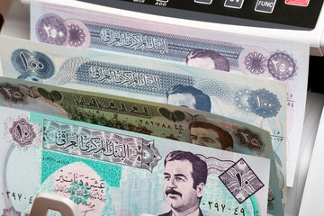 Old Iraqi  Dinar in a counting machine