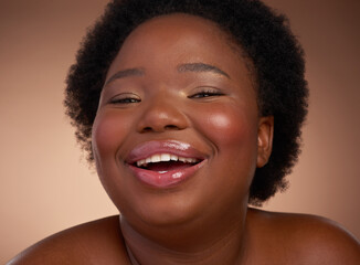 Happy, portrait and black woman in studio for beauty or skincare with make up, cosmetics and wellness. Person, isolated and beige background with lip balm for glow or self care, plus size and shine.