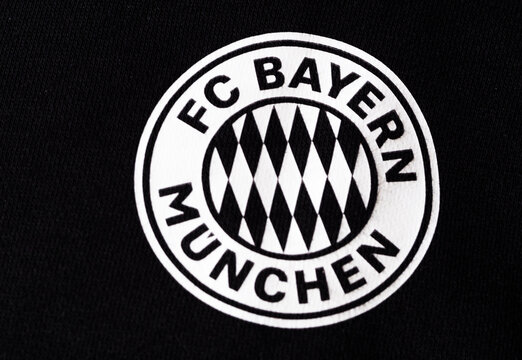 In this photo illustration,  FC Bayern Munich logo seen displayed on a sportswear