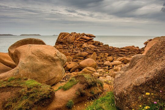 Beach of Ploumanach in Perros-Guirec, Brittany France. Pink Granite Coast in northern Brittany, France, an idyllic rocky beach in the pink granite blockfield of Ploumanac'h.