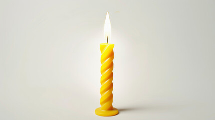 A single yellow twisted candle burning with a bright flame against a minimalist off-white background.