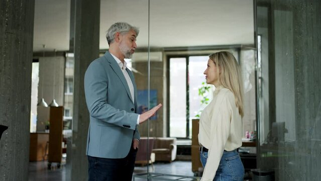 Manager scolding employee in modern office. Employee making mistake. Company director is angry, dissatisfied for worker's poor quality work and missed deadline.