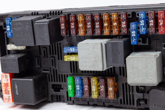 Pavlodar, Kazakhstan - 04.20.2020: Automotive fuses and relay box with mercedes-Benz and Hella Logo . Catalog of spare parts.