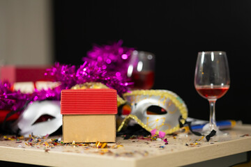 Obraz na płótnie Canvas background and banner - mask and wine glasses. gift box wine glass mask background