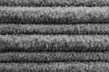 a close-up shot of a gray corduroy outfit
