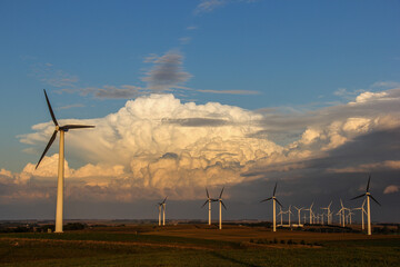 wind turbines with storm clouds