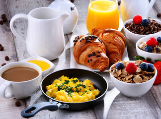 Breakfast served with coffee, juice, croissants and fruits - 790186757