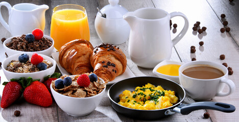 Breakfast served with coffee, juice, croissants and fruits - 790186758