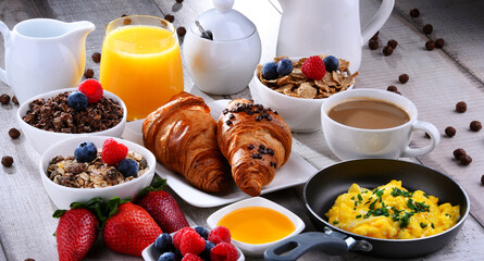 Breakfast served with coffee, juice, croissants and fruits - 790186764