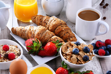Breakfast served with coffee, juice, croissants and fruits - 790186768
