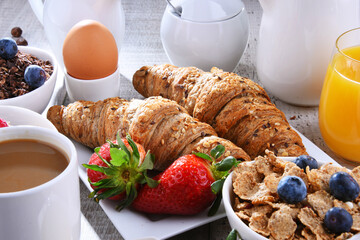 Breakfast served with coffee, juice, croissants and fruits - 790186787