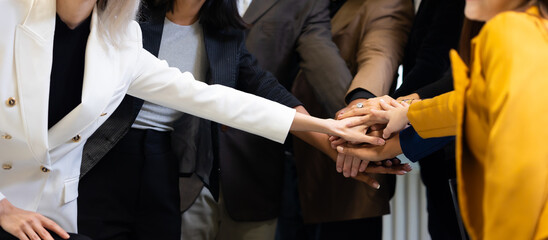 Unity and teamwork - Professional business team hands together celebrate success work. Unity and teamwork concept.