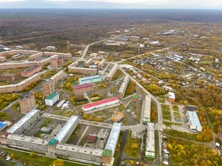 Tuinposter Aerial view to Igarka town at early autumn, Russia. Igarka is a town in Turukhansky District of Krasnoyarsk Krai, Russia, located 163 kilometers (101 mi) north of the Arctic Circle © Вера Тихонова
