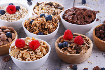 Bowls with different sorts of breakfast cereal products