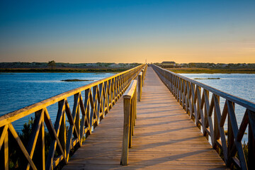 Fototapeta na wymiar Quinta do Lago Bridge in Ria de Formosa natural park in Faro, Algarve in Portugal during sunset