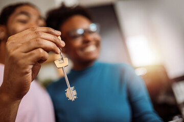 Closeup of keys that African American couple got from their real estate agent for their new home - 790197700