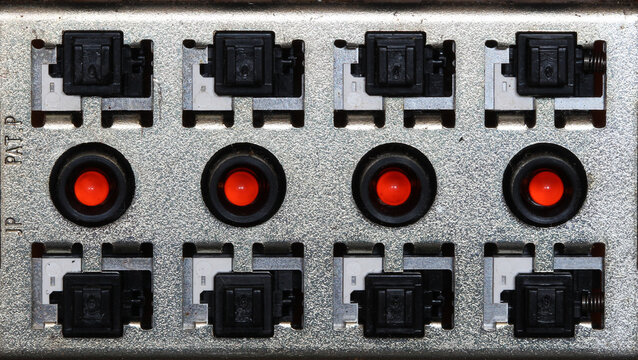 red led and switch connections on rectangular metal circuit panel 