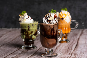 Tea, chocolate and green tea ice cream in glass cup.Collection of different desserts.Gourmet summer...