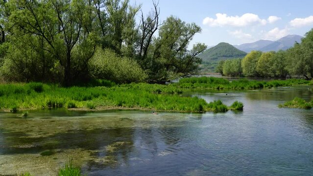 Idyllic view at Posta Fibreno Lake Natural Reserve. In the province of Frosinone, Lazio, Italy.