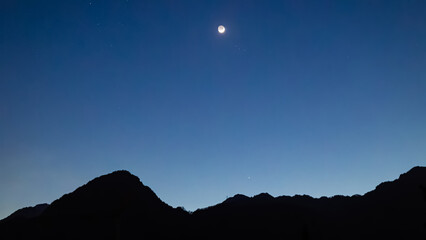 night in the mountains. contrast photo alpine mountains. night sky in the stars. outdoor recreation in the mountains.