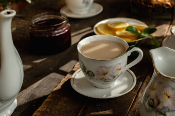 Tea party. Porcelain cup of tea with milk.