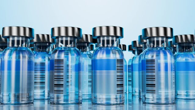 Glass bottle with a barcode label and medicine inside. Vaccination concept. Bottles with the drug for medical purposes. Antibiotics. Camera movement along glass bottles with medicine.